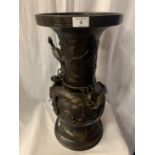 A LARGE DECORATIVE ORIENTAL BRONZE VASE EMBOSSED WITH DRAGON AND BIRD FIGURES - 56CM HIGH 28CM