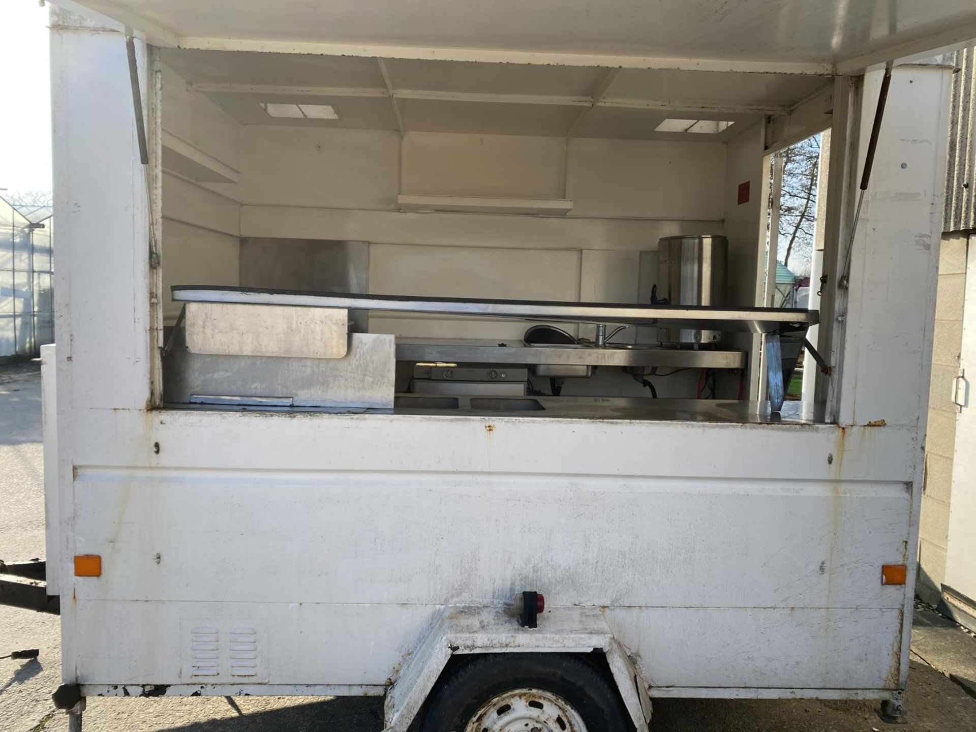 A CATERING TRAILER WITH LIFT UP SIDE. 8'3" LONG, 6' WIDE, DRAW BAR 3'3" LONG TOTAL LENGTH 11'6" WITH - Image 5 of 10