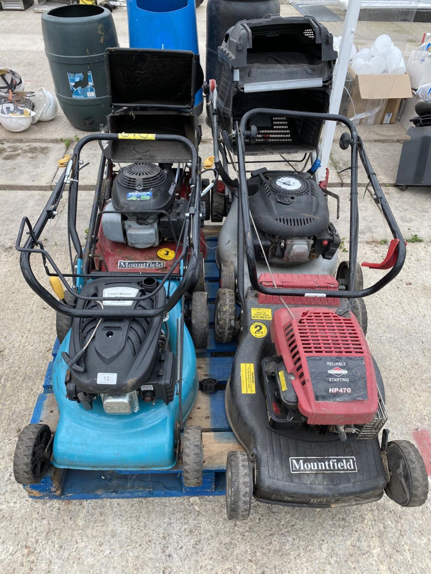 FOUR LAWN MOWERS - A MOUNTFIELD WITH 4.5 HONDA ENGINE, A MOUNTFIELD HP470 WITH B & S ENGINE A WOLF