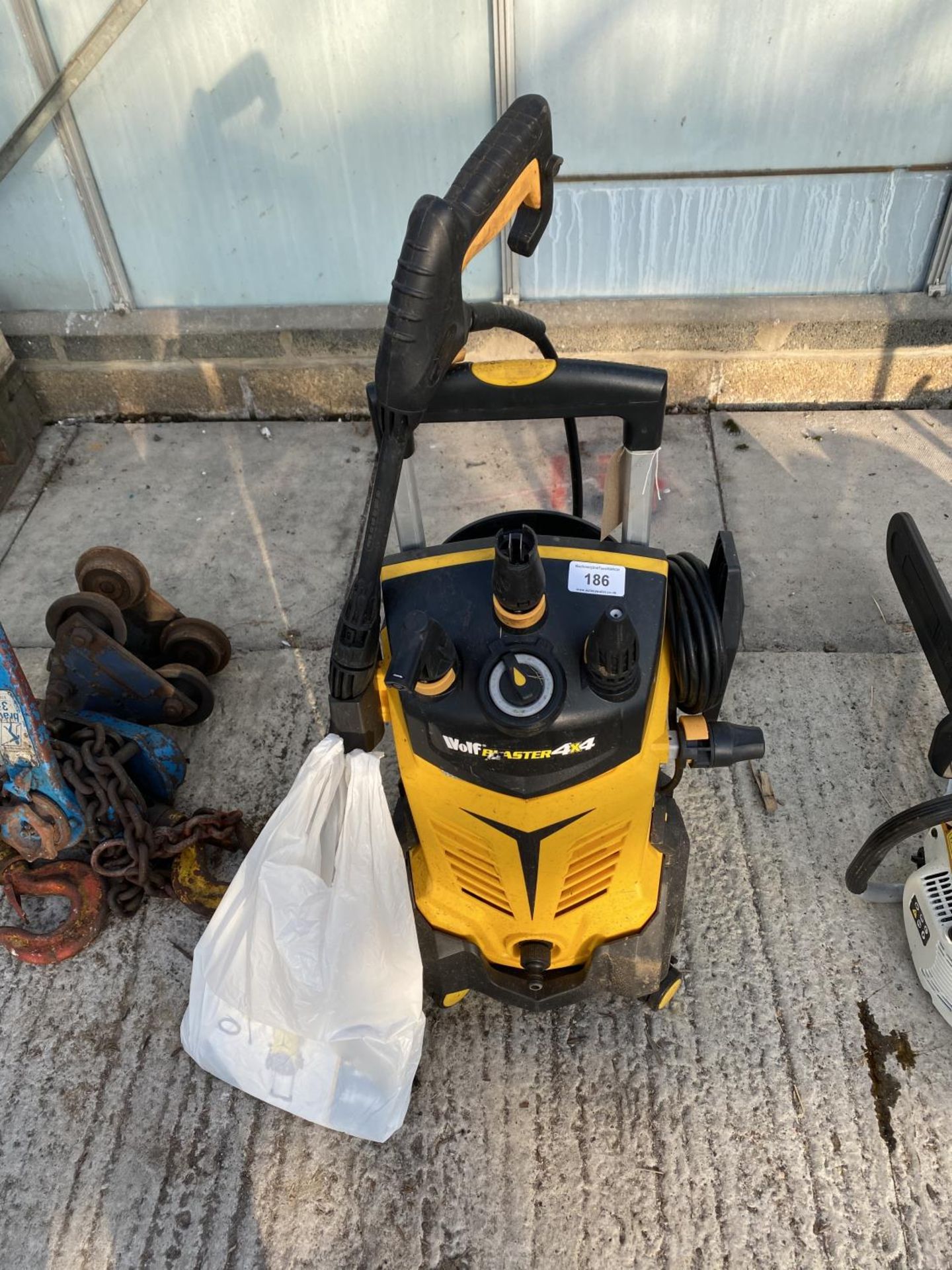 A WOLF PRESSURE WASHER BELIEVED WORKING BUT NO WARRANTY - NO VAT