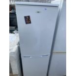 A WHITE LOGIK UPRIGHT FRIDGE FREEZER BELIEVED WORKING BUT NO WARRANTY