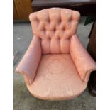 AN EDWARDIAN BUTTON-BACK LOW NURSING CHAIR