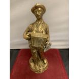 A BRASS FIGURINE IN THE FORM OF AN ACCORDIAN PLAYER H:28CM