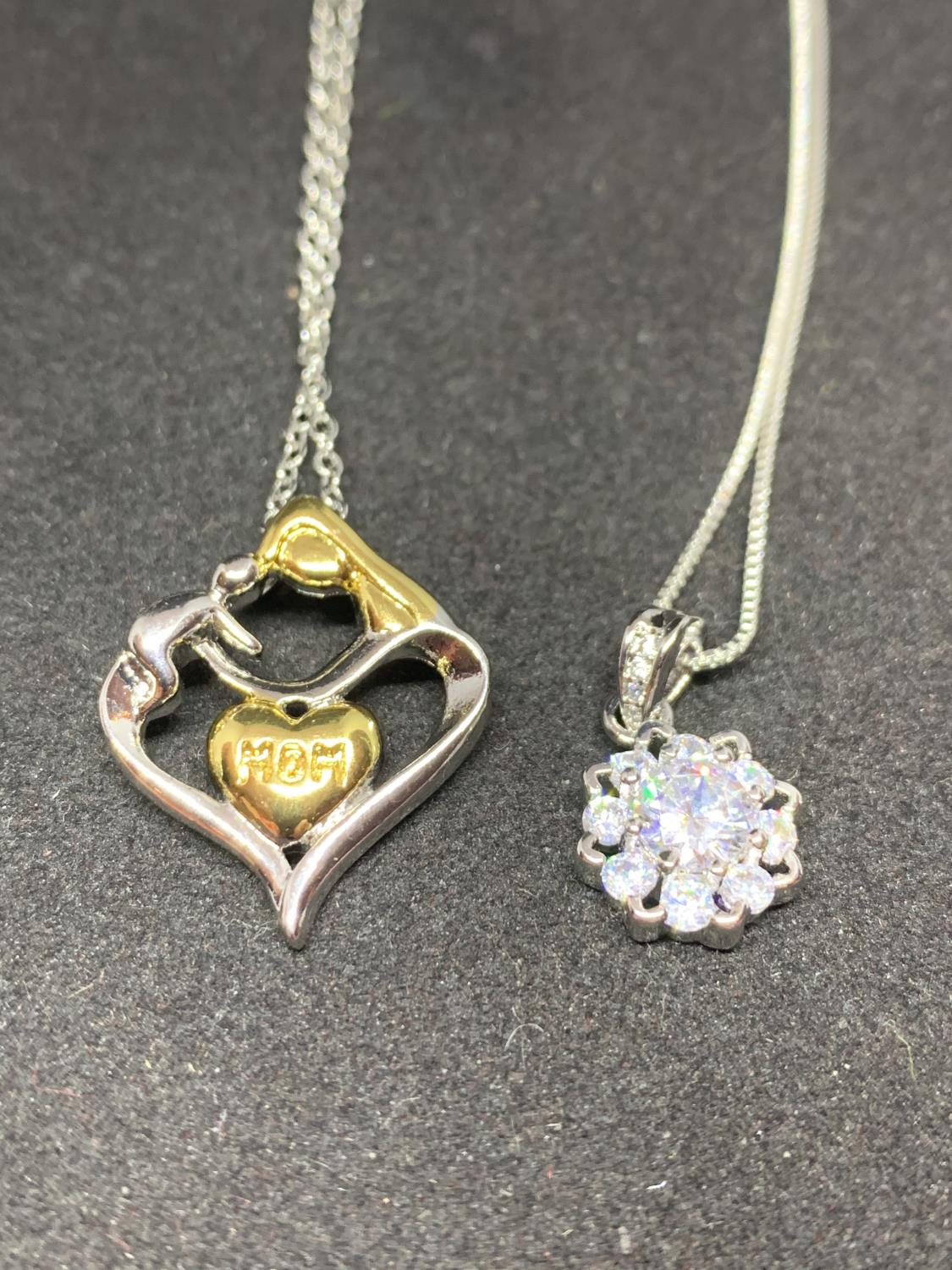 FOUR SILVER NECKLACES WITH PENDANTS TO INCLUDE HEARTS, CROWN AND FLOWER - Image 6 of 6