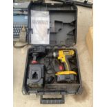 A DEWALT BATTERY POWERED DRILL WITH CHARGER AND SECOND BATTERY