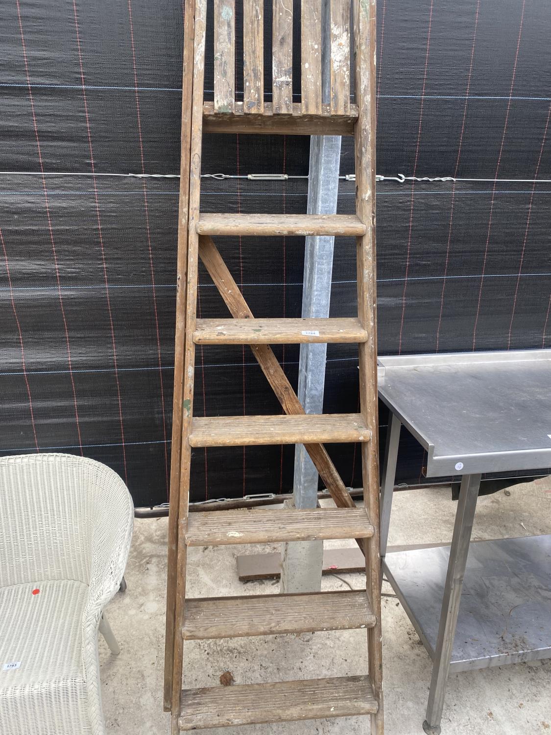 A VINTAGE SIX RUNG WOODEN STEP LADDER