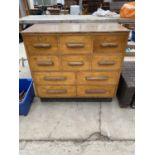 A HABERDASHERY STORAGE CHEST OF DRAWERS ENCLOSING SIX SHORT AND FOUR LONG DRAWERS