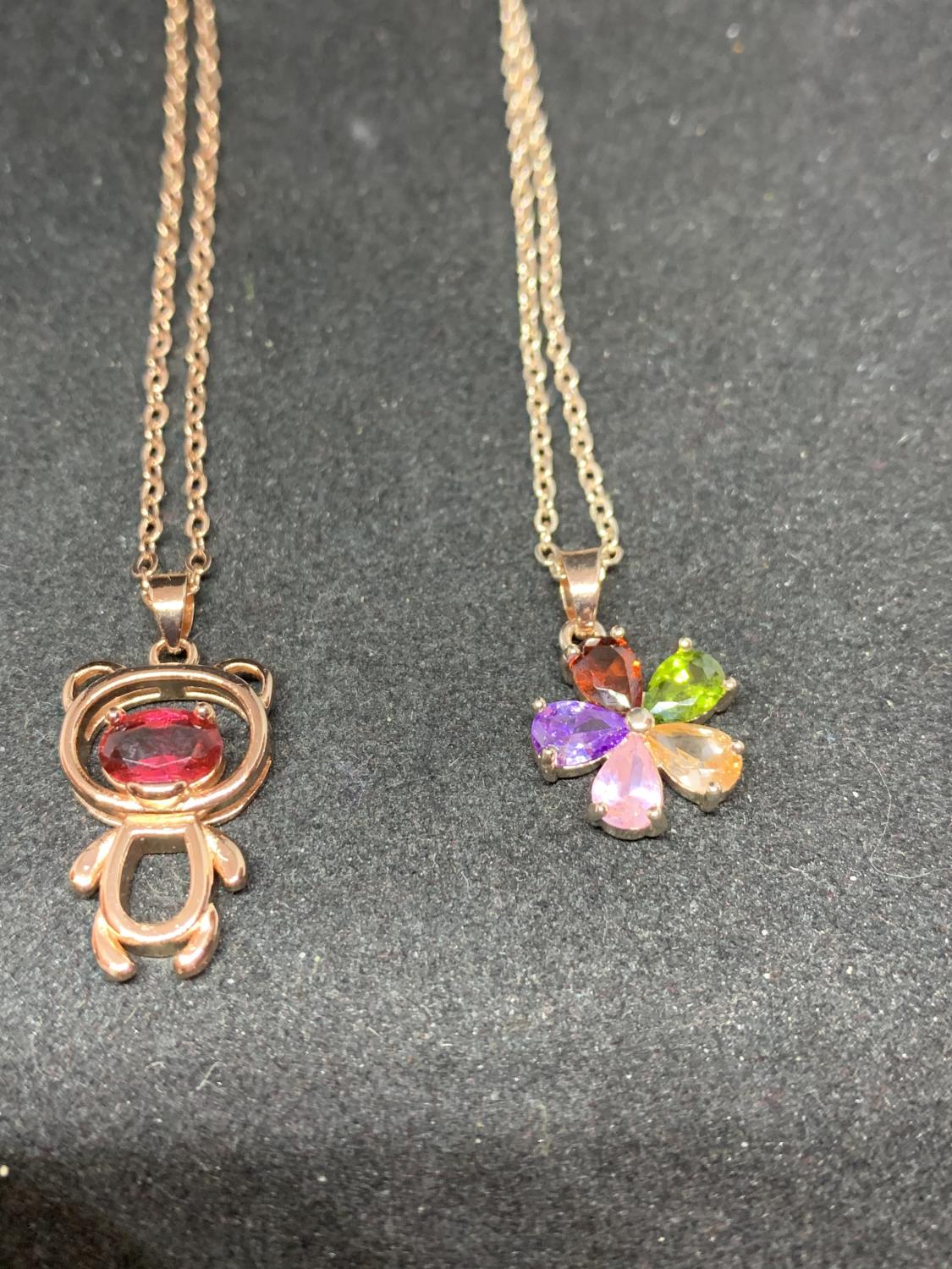 FOUR SILVER NECKLACES MARKED 925 WITH PENDANTS TO INCLUDE A TEDDY, FLOWER ETC WITH COLOURED STONES - Image 5 of 6