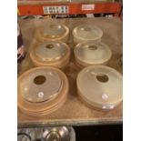 THREE PEACH AND GOLD ROUND GLASS LIGHTSHADES AND THREE FURTHER EXAMPLES