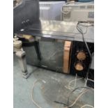 A BLACK GOODMANS MICROWAVE OVEN BELIEVED IN WORKING ORDER BUT NO WARRANTY