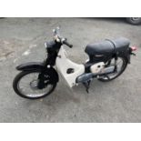 A 1963 HONDA C100 MOTORCYCLE. 50 CC. A USA IMPORT WITH NOVA CERTIFICATE TO REGISTER A V5 WITH AN AGE