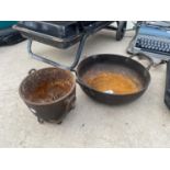 A VINTAGE CAST IRON TWO HANDLED PAN AND A FURTHER CAST COULDRON