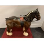 A BESWICK BAY SHIRE HORSE WITH HARNESS