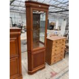 A CHERRY WOOD CORNER CABINET WITH LOWER DOOR AND UPPER GLAZED DOOR