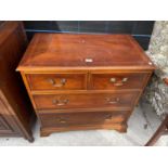 A BRADLEY YEW WOOD CHEST OF TWO SHORT AND TWO LONG DRAWERS