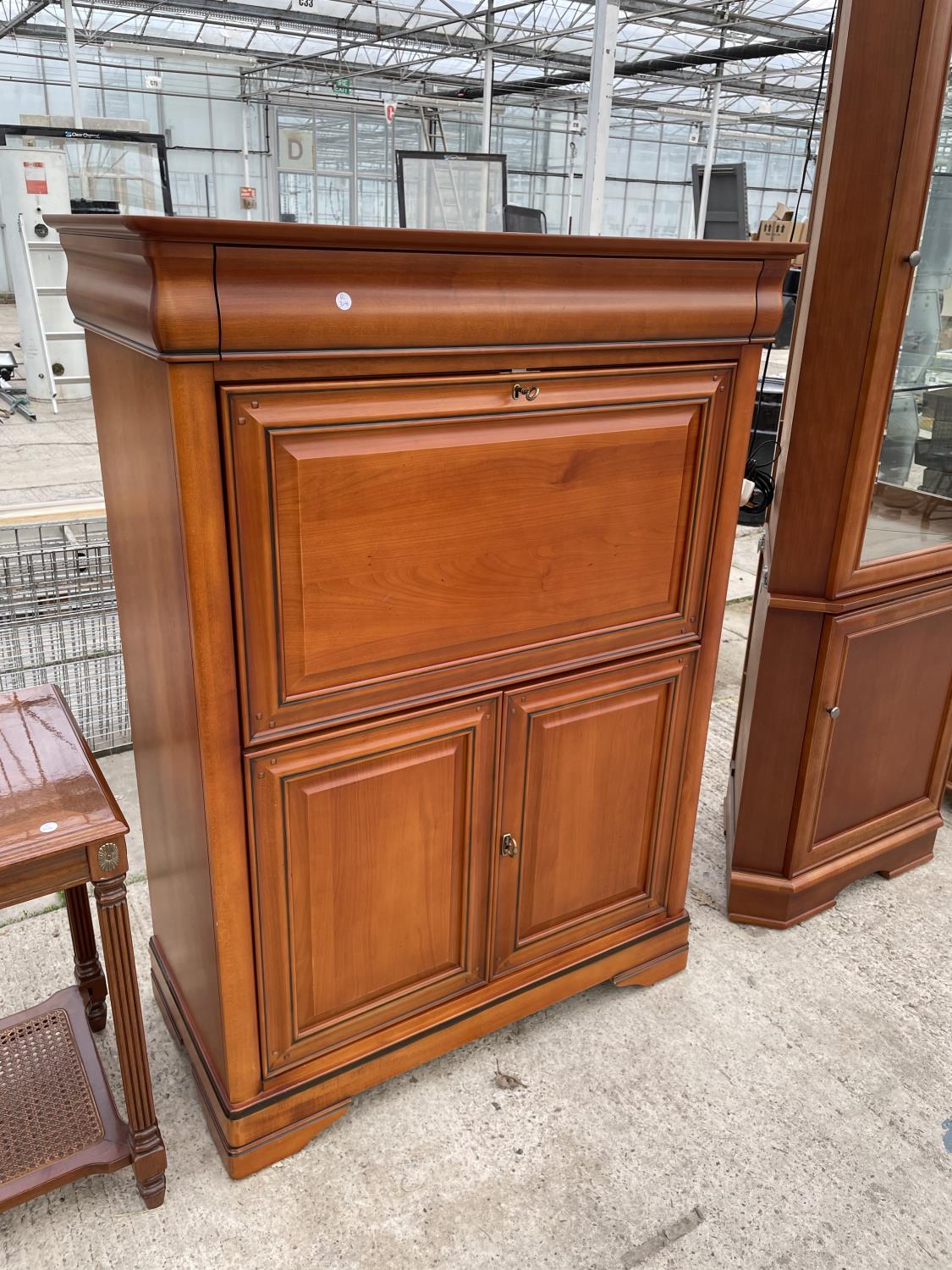 A CHERRY WOOD BUREAU CABINET WITH FALL FRONT, UPPER SECRET DRAWER AND TWO LOWER DOORS
