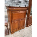 A CHERRY WOOD BUREAU CABINET WITH FALL FRONT, UPPER SECRET DRAWER AND TWO LOWER DOORS