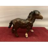 A BESWICK SHETLAND PONY