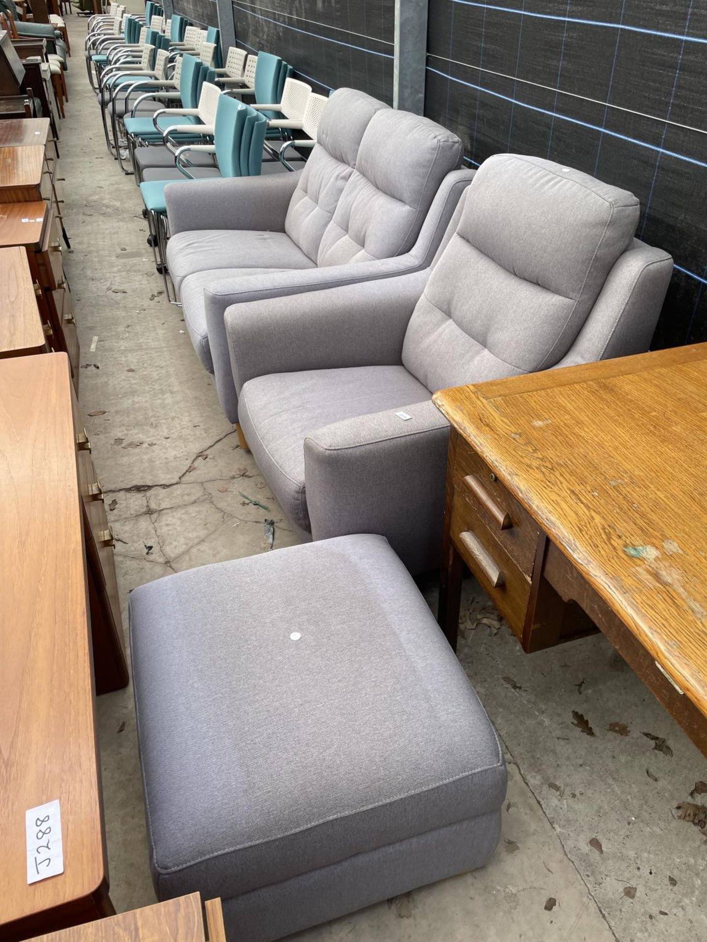 A MODERN TWO SEATER SETTEE, EASY CHAIR, POUFFE AND A MAHOGANY FRAMED MIRROR