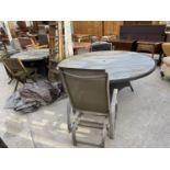 A LARGE CIRCULAR GARDEN PATIO TABLE WITH THREE CHAIRS, A CIRCULAR PATIO TABLE WITH FOUR WOODEN