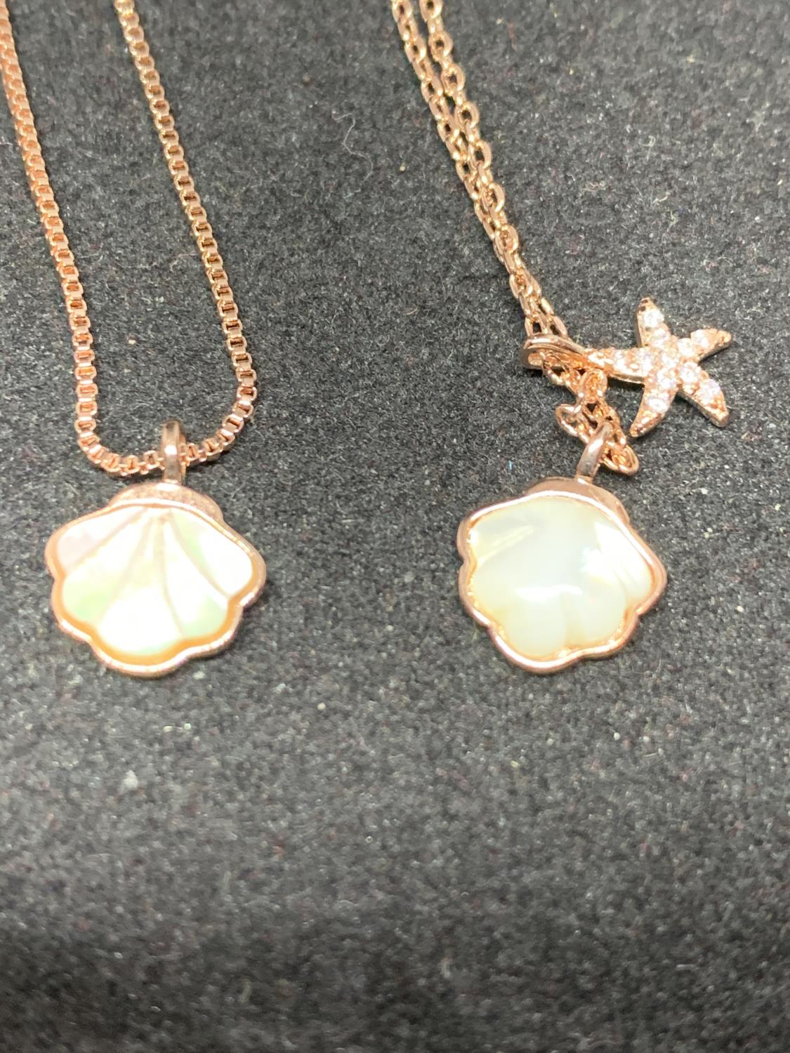 FOUR SILVER NECKLACES MARKED 925 WITH ROSE COLOURED GILDING WITH SHELL AND STAR FISH PENDANTS - Image 4 of 8