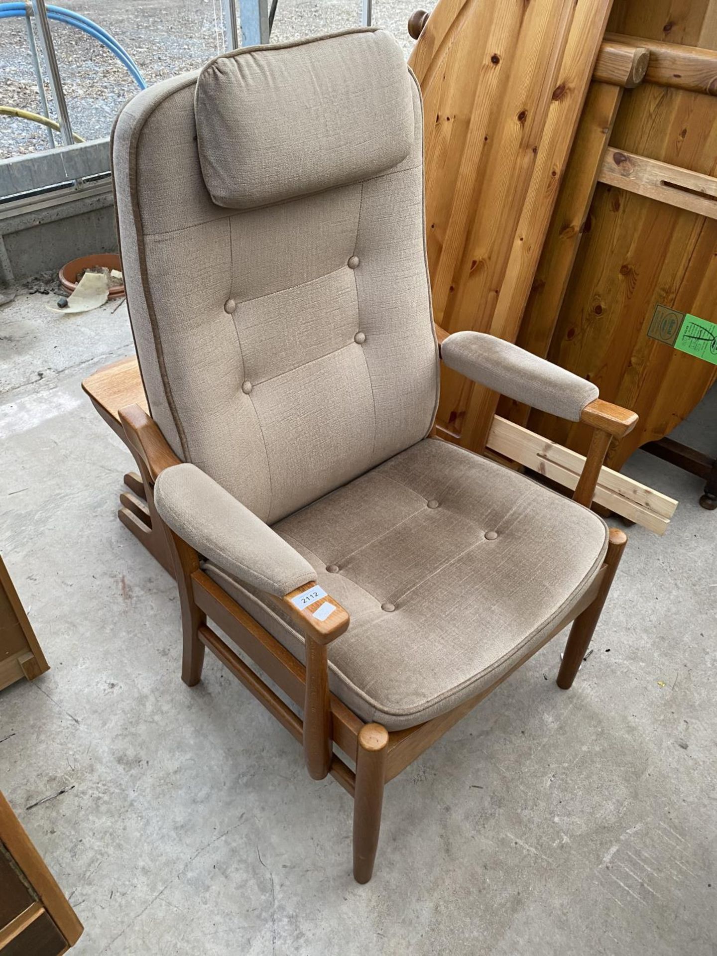 A MOBLER ADJUSTABLE FIRESIDE CHAIR WITH BUTTON-BACK AND SEAT