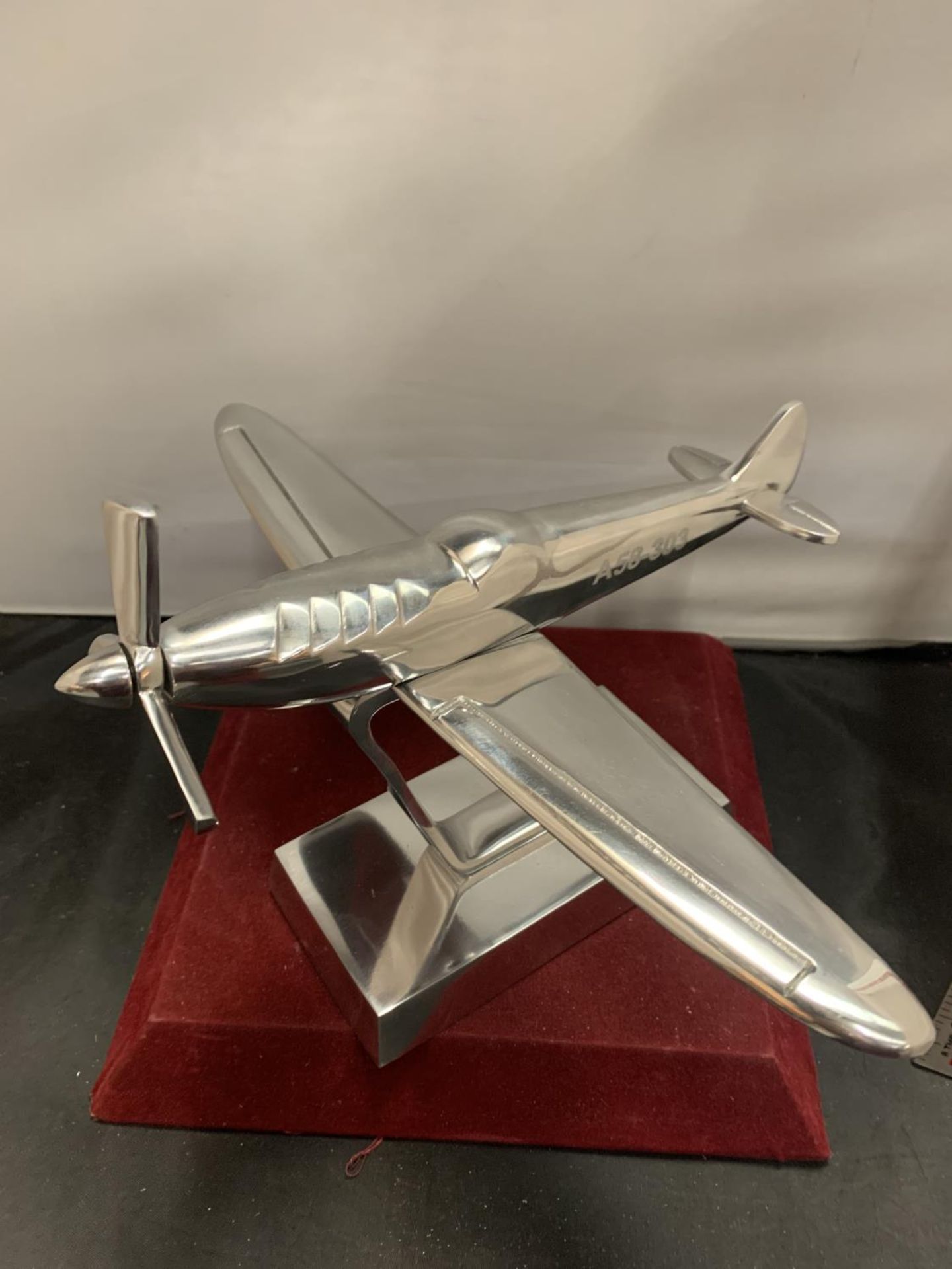 A CHROME MODEL A58-303 AEROPLANE ON A PLINTH OF THE SAME H:23CM