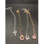 FOUR SILVER NECKLACES MARKED 925 WITH PENDANTS TWO IN ROSE GOLD COLOUR