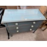 A PAINTED CHEST OF THREE DRAWERS