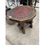 A VINTAGE LEATHER TOPPED SIDE TABLE/STOOL