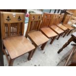A SET OF SIX HARDWOOD GOTHIC STYLE DINING CHAIRS ON SPLAY LEGS