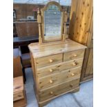 A PINE CHEST OF TWO SHORT AND THREE LONG DRAWERS AND A MATCHING DRESSING TABLE MIRROR