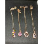 FOUR SILVER NECKLACES MARKED 925 WITH PENDANTS TO INCLUDE CLEAR AND COLOURED STONES ALL WITH ROSE