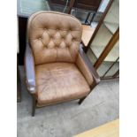 A MID 20TH CENTURY BUTTON-BACK FIRESIDE CHAIR