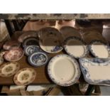 A LARGE QUANTITY OF CERAMIC PLATES TO INCLUDE ELEVEN BLUE AND WHITE MEAT PLATTERS ETC