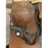 A 1930'S CROMWELLS MOTORCYCLE HELMET AND A PAIR OF GOGGLES