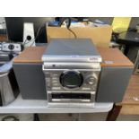 A DUAL 3 DISC CHANGER RADIO CASSETTE STEREO SYSTEM BELIEVED IN WORKING ORDER BUT NO WARRANTY