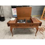 A HOUSED GARRARD RECORD PLAYER WITH BUILT IN SPEAKERS THIS ITEMS TO BE COLLECTED FROM THE