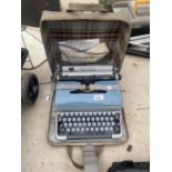 A BLUE BIRD TYPE WRITER WITH CARRY CASE