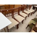 A SET OF SIX REGENCY STYLE YEW WOOD CROSSBANDED DINING CHAIRS
