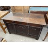 A JACOBEAN STYLE OAK BLANKET CHEST WITH APPLIED MOULDING TO PANELED FRONT AND DRAWER TO BASE - 48"