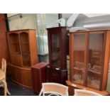 A GROUP FOUR VARIOUS CABINETS TO INCLUDE TWO CORNER CABINETS, AND A LARGE GLASS FREONTED CABINET ETC