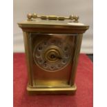 A LATE VICTORIAN BRASS CARRIAGE CLOCK WITH KEY