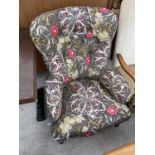 A VICTORIAN STYLE BUTTON-BACK CHAIR ON TURNED FRONT LEGS