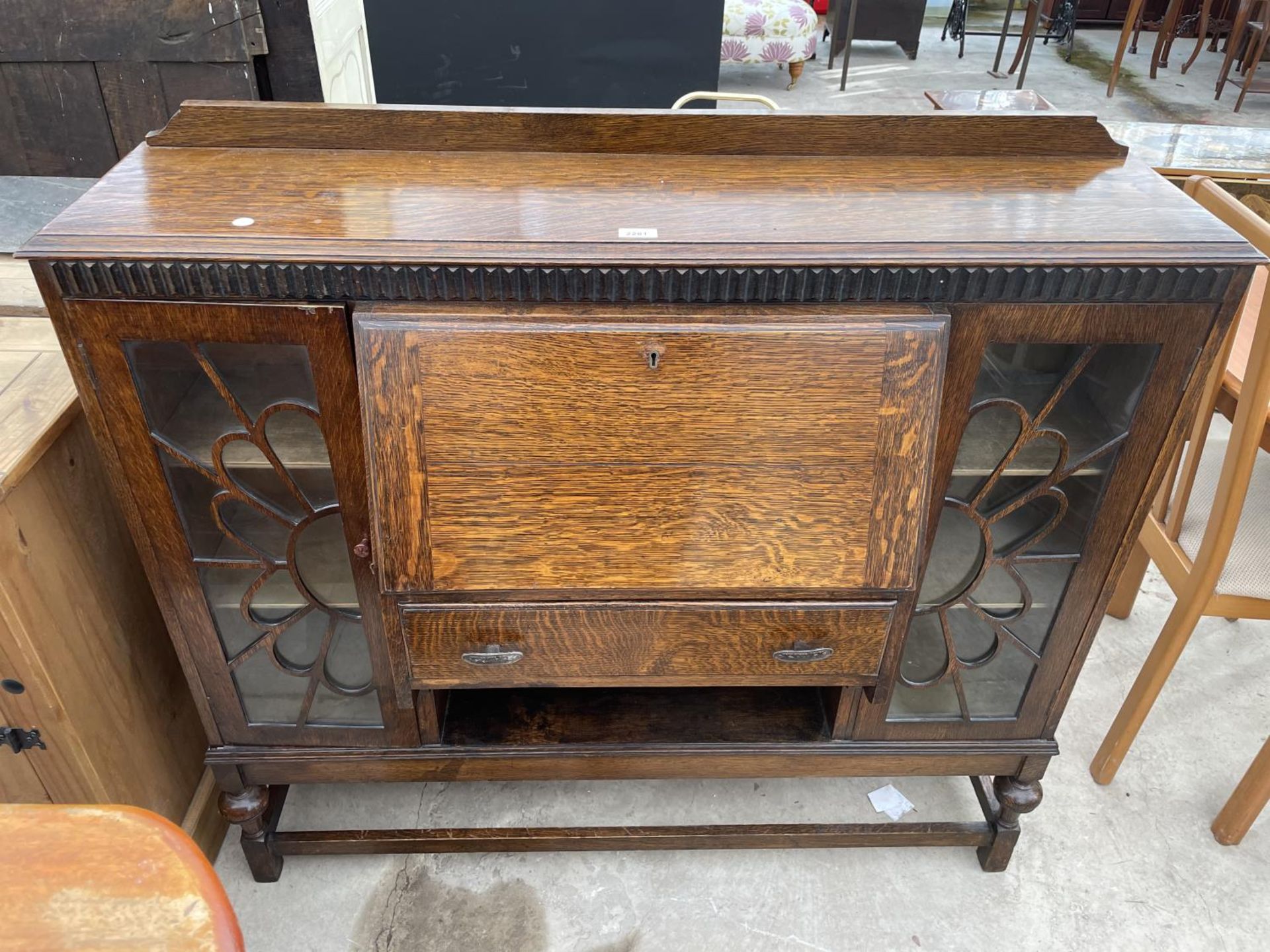 AN EARLY 20TH CENTURY OAK SIDE BY SIDE CABINET, 48" WIDE GLASS ON RIGHT PANEL NEEDS REPLACING