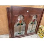 A WOODEN FRAMED WINDOW WITH STAINED GLASS