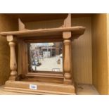 A WOODEN DRESSING TABLE MIRROR