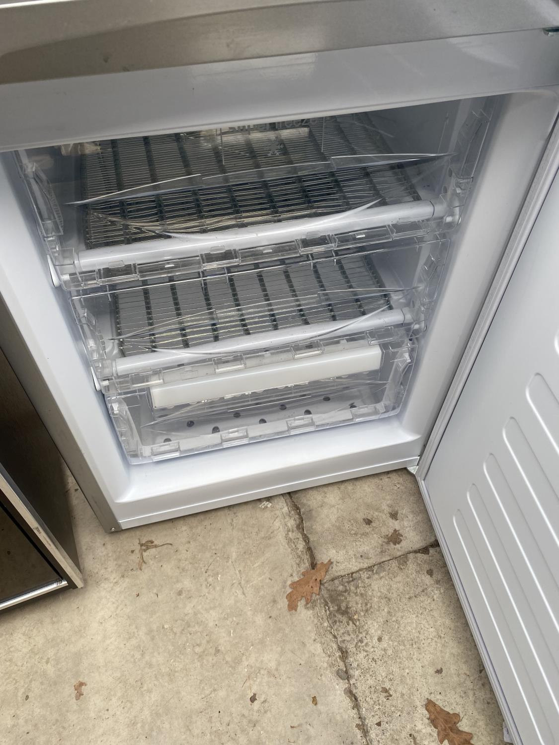 A SILVER HOTPOINT FRIDGE FREEZER BELIEVED IN WORKING ORDER BUT NO WARRANTY - Image 5 of 5