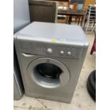 A SILVER INDESIT WASHING MACHINE BELIEVED IN WORKING ORDER BUT NO WARRANTY