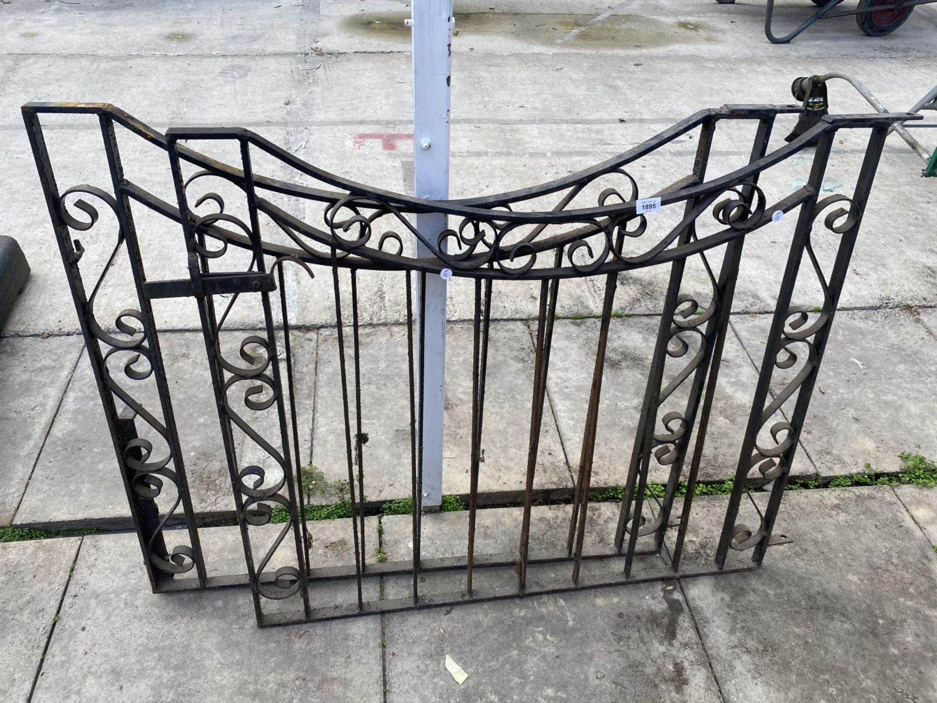 A PAIR OF DECORATIVE WROUGHT IRON GATES